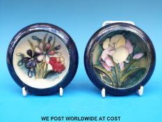 Two c1930's Moorcroft shallow dishes decorated with flowers,