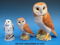 A pair of Beswick owls and a Royal Worcester Snowy owl