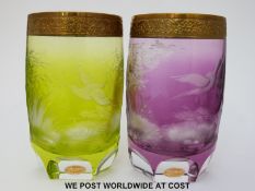 A pair of Moser flash overlaid cut glass beakers decorated with birds amongst foliage with gilt