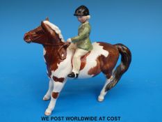 A Beswick girl on a pony
