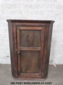 A 19thC oak corner cupboard (height 103cm)