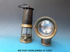 A Miller motorcycle acetylene lamp approximately 16cm tall,
