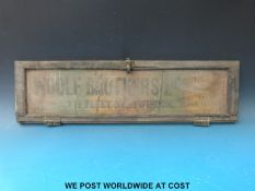 A 1st half 20thC tram window with advertising for Woolf Brothers Ltd, Tailors,