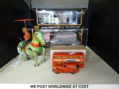 Six diecast model vehicles together with a clock work car and a clockwork horse,