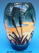 An Moorcroft ovoid vase decorated with bullrushes in the 'Reeds at Sunset' design by Philip