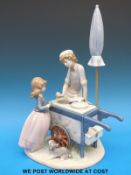 A Lladro figural group of an ice cream vendor with girl,