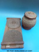 A carved Indian tobacco jar/tea caddy and a carved wooden book slide