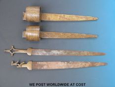 A pair of Sudanese arm daggers with brass fittings,