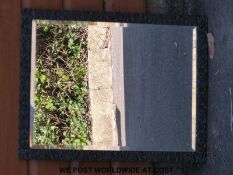 A bevelled mirror with painted black frame (53 x 66cm)