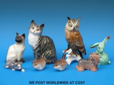 A collection of small ceramic figures including Karl Ens owl, Lomonosov, Beswick,