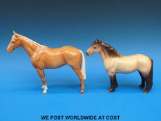 A Beswick Highland pony and a palomino hunter