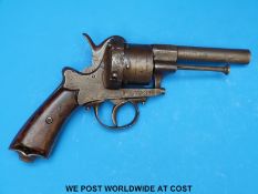 A six shot hammer action pinfire revolver with engraved side plates and back strap,