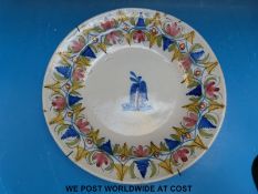 A late 19th/20thC Chinese crackle glazed dish (30cm in diameter) and a continental faience charger