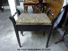 An ebonised piano stool containing a collection of music, includes wartime 1940s examples,