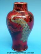 A Bernard Moore flambé shouldered vase hand decorated with peacocks on a bough,