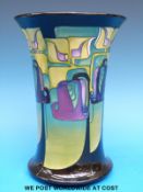 A Moorcroft large vase decorated with stylised bluebells in the Mackintosh style (20cm tall)
