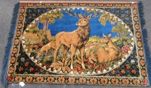 A wall hanging of a stag (width 144cm)