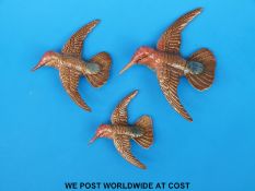 A set of three Beswick graduated hummingbird wall plaques