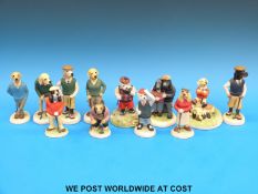 Twelve Robert Harrop golfing dogs,