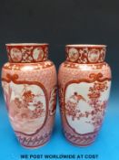 A pair of Japanese Kutani vases decorated with scenes of cockerels and birds amongst foliage (27.