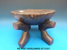 An African hardwood stool originally given to Commissioner R A McRae of Nyasaland (19cm tall)