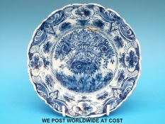 An 18thC Dutch Delft plate of small proportions with blue and white floral decoration (16cm