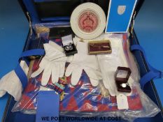 A cased quantity of Masonic regalia including three aprons, jewels,