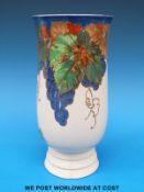 A Royal Doulton vase decorated with grapes and vine leaves on cream ground,