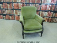 A neoclassical style armchair with carved decoration to arms and front rail,