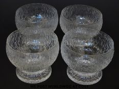 A set of four Iittala Finland 'Kekkert' bowls designed by Timo Sarpaneva with globular body raised