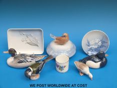 A collection of Bing and Grondahl and Copenhagen porcelain including a figural bird pot,