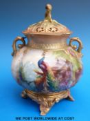 A Royal Worcester pot pourri hand decorated with peacocks in a pine tree signed R.