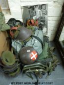 A quantity of military helmets,