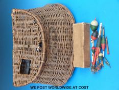 An angler's wicker creel and box of old floats