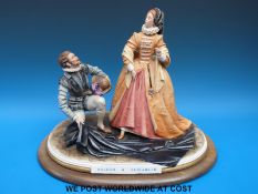 A Capodimonte figure group Raleigh and Elizabeth,