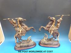 A pair of spelter warriors on rearing horses (height 43cm)