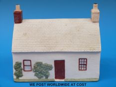 A Goss pastille burner with ' A Window in Thrums' to base