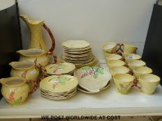 Carltonware tea set decorated with foxgloves on yellow ground with bamboo effect handles