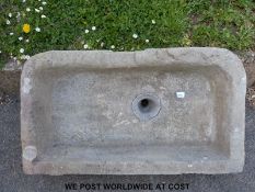 A natural stone trough or sink with lead waste pipe (83 x 47 x 16cm)