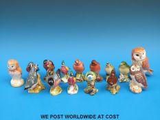 A collection of small Beswick birds
