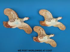 A set of three Beswick graduated grouse wall plaques