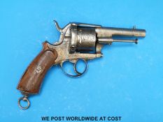 A six shot hammer action pin fire revolver with shaped chequered grip,