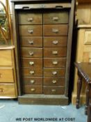 A Lebus oak tambour fronted set of filing or shopfitting haberdashery drawers (W58 x D50.