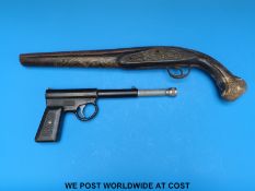 A brass wire inlaid pistol together with a TJ Harrington & Son 'The Gat' pistol