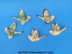 Five Beswick blue tit wall plaques comprising two of model no 707, no 706 and two of model 705,