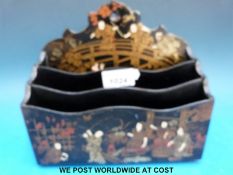 A Japanese lacquer letter rack decorated with figures