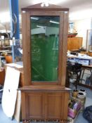 Oak shop display type corner gun cabinet.