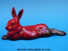 A Royal Doulton flambé hare lying down signed Noke (length 19cm)