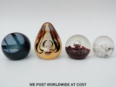 Four Caithness glass paperweights,