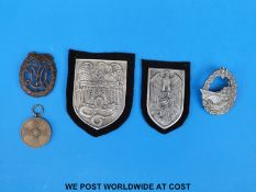 A group of WWII Nazi related badges etc.